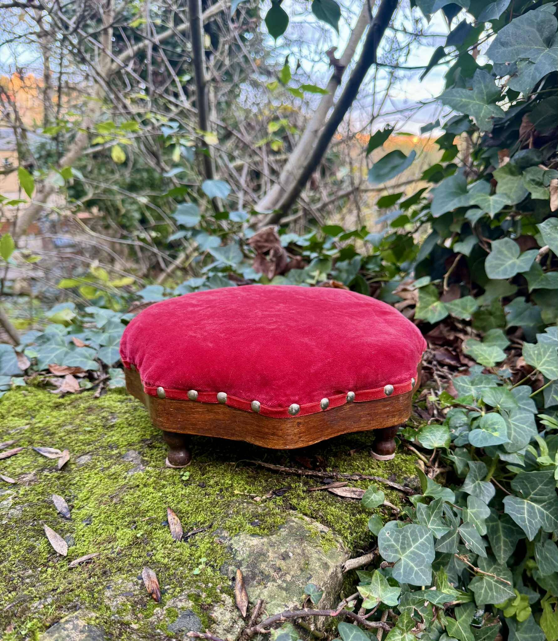 Red velvet footstool in the Louis XV style
