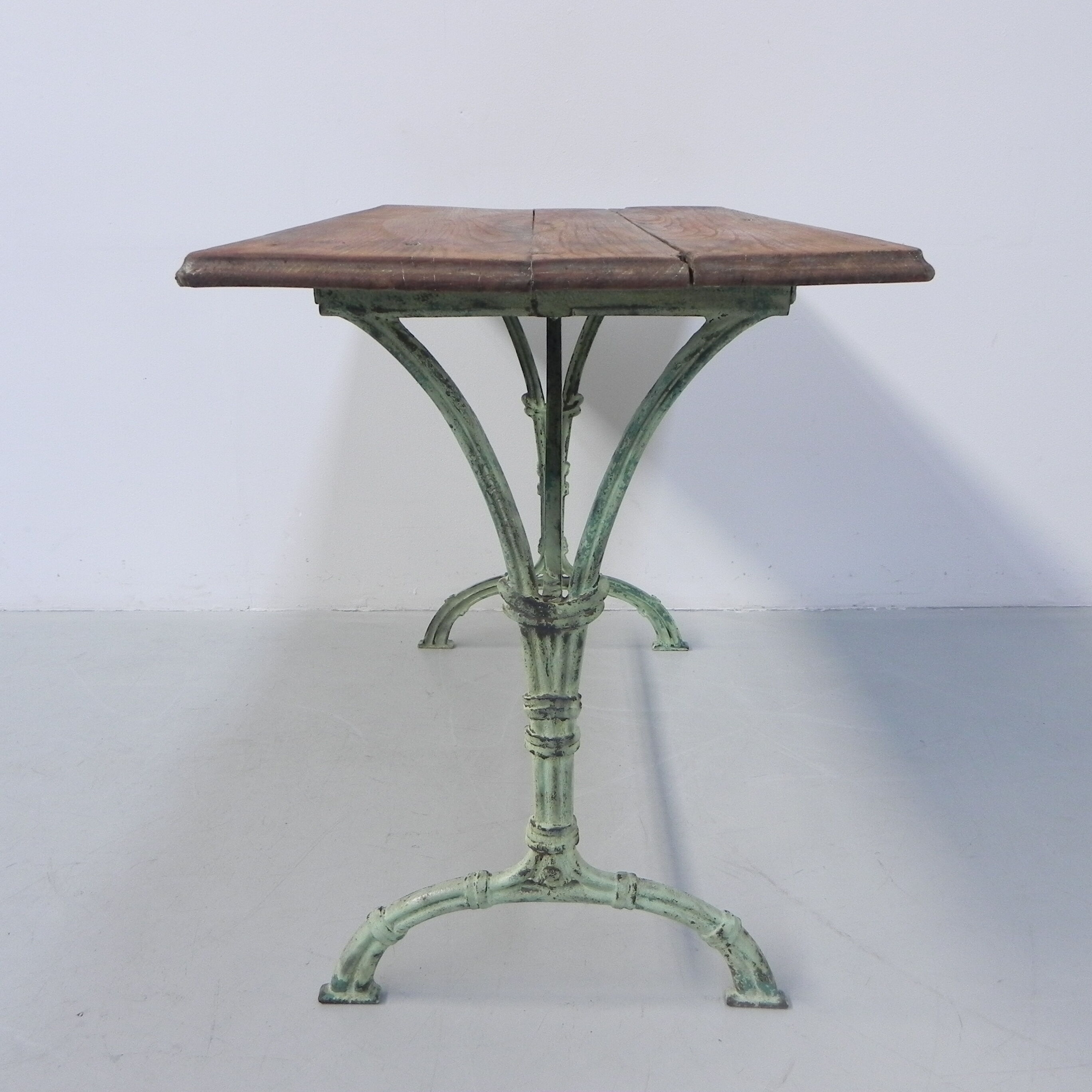Art nouveau bistro table with cast iron frame