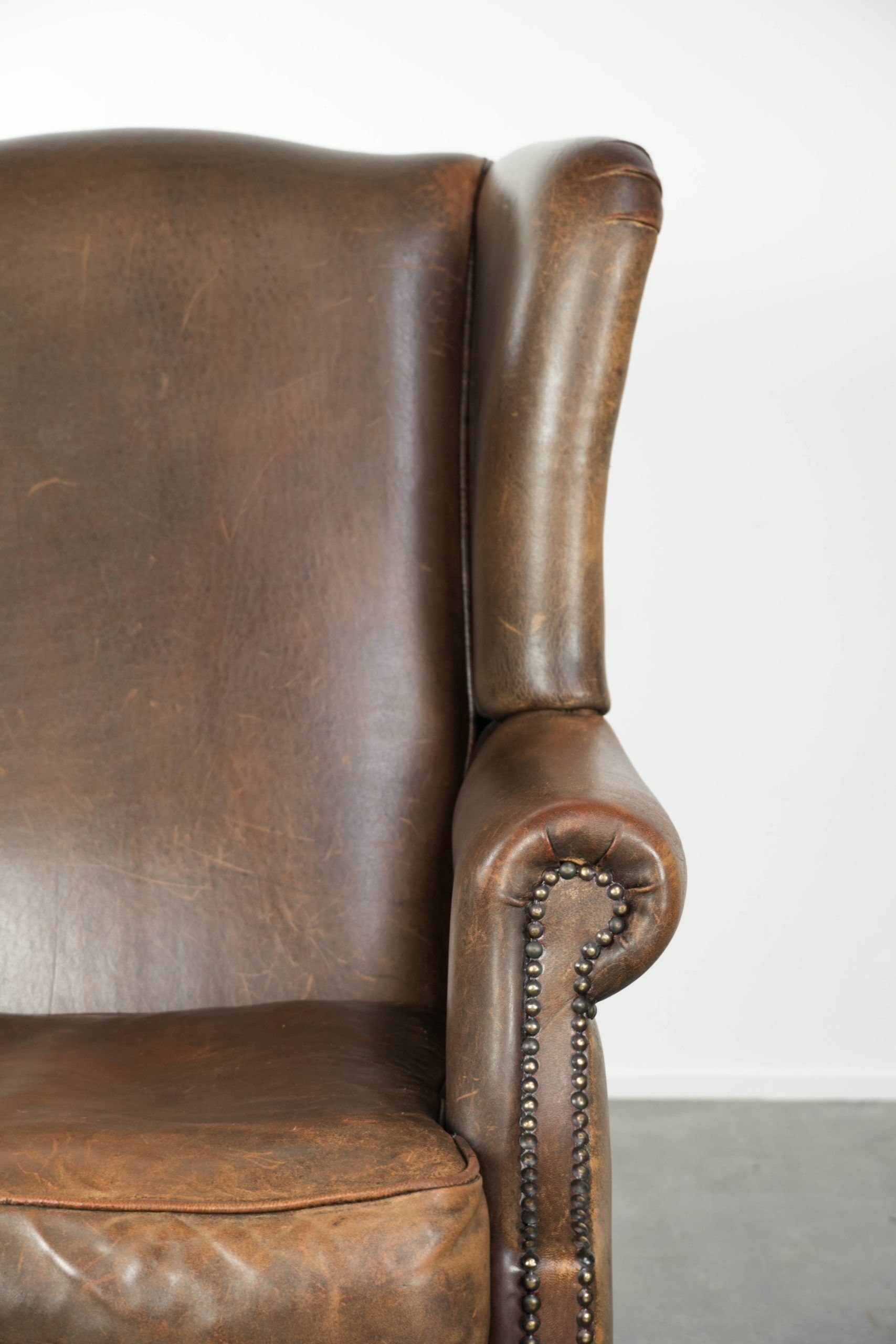Large sheepskin wingback armchair with beautiful warm colours