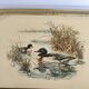 Vintage service tray with a golden gallery and mirror, decorated with ducks.