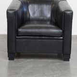 Very comfortable black Art Deco design armchair, made of sheepskin leather