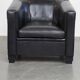 Very comfortable black Art Deco design armchair, made of sheepskin leather