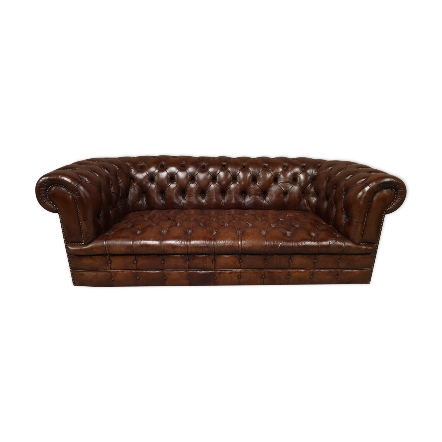 Upholstered chesterfield brown sofa