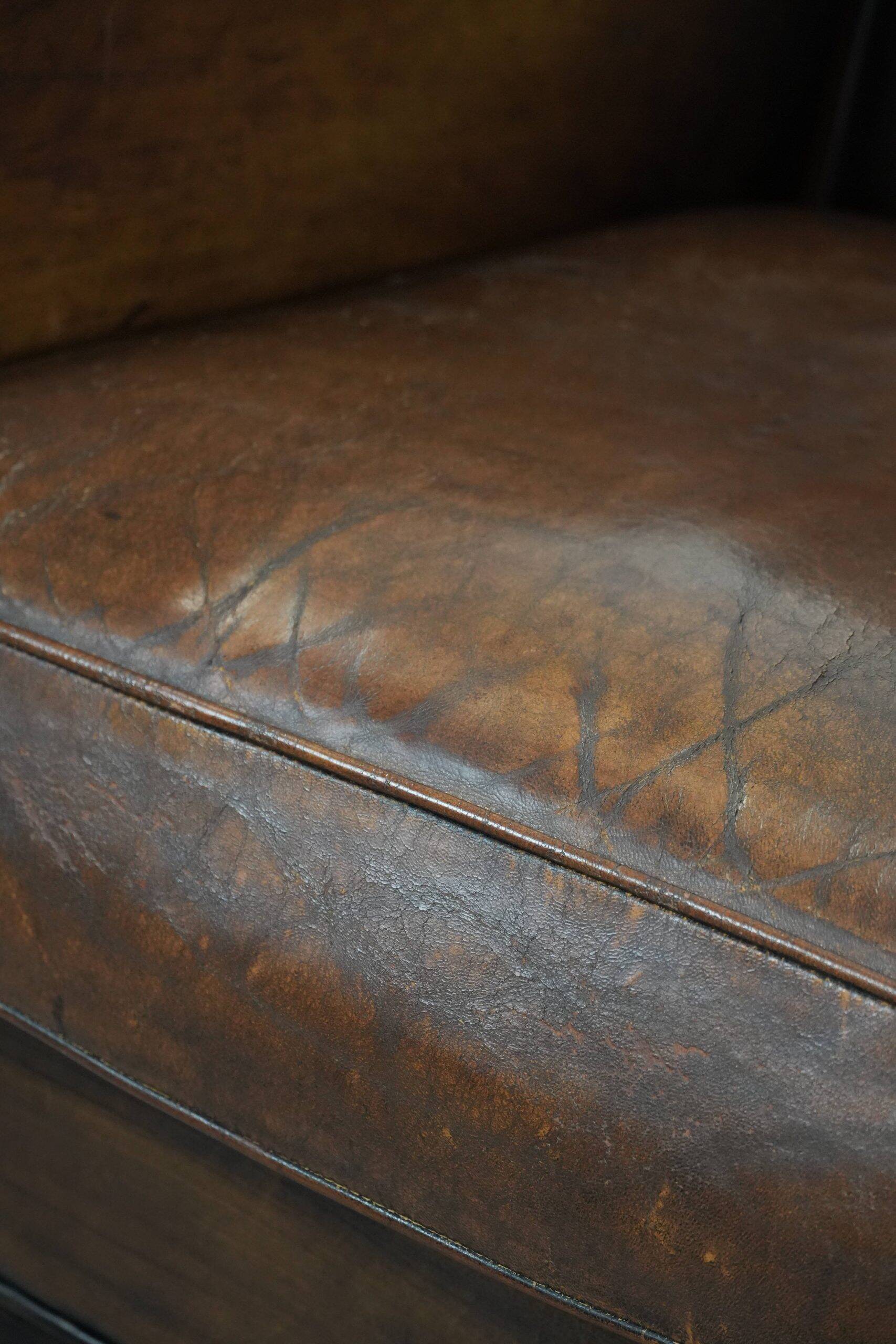 Beautifully shaped vintage sheepskin armchair with character