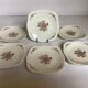 Six small Raynaud Limoges flower plates