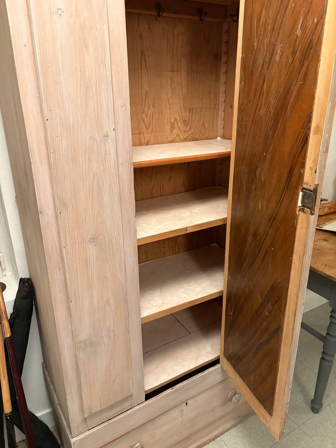 Antique English wardrobe in pale pink patina.