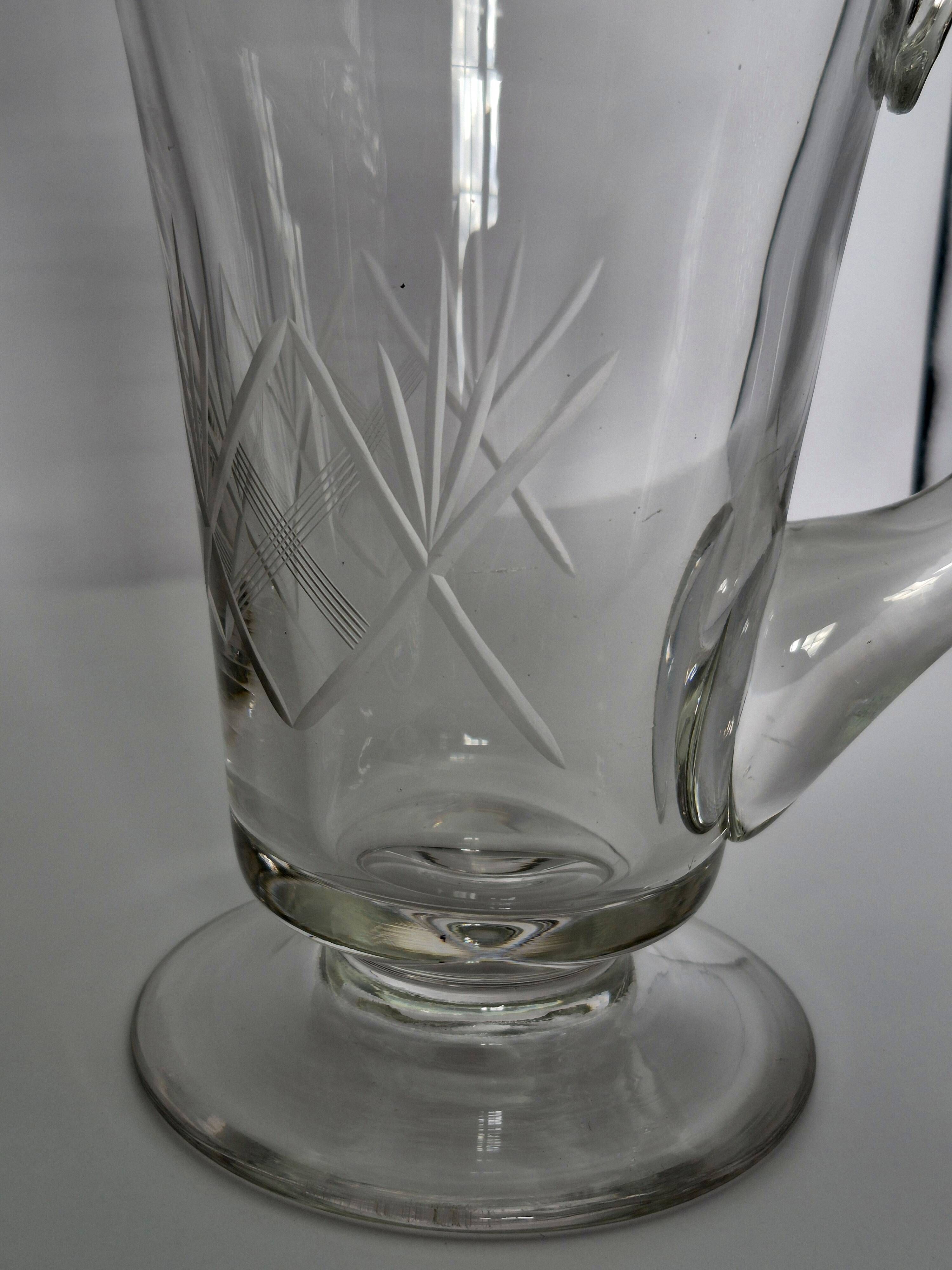 Crystal service from Fains, matching wine carafe and water jug.