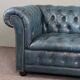 Chesterfield sofa buttoned in blue cowhide, 2.5 seats