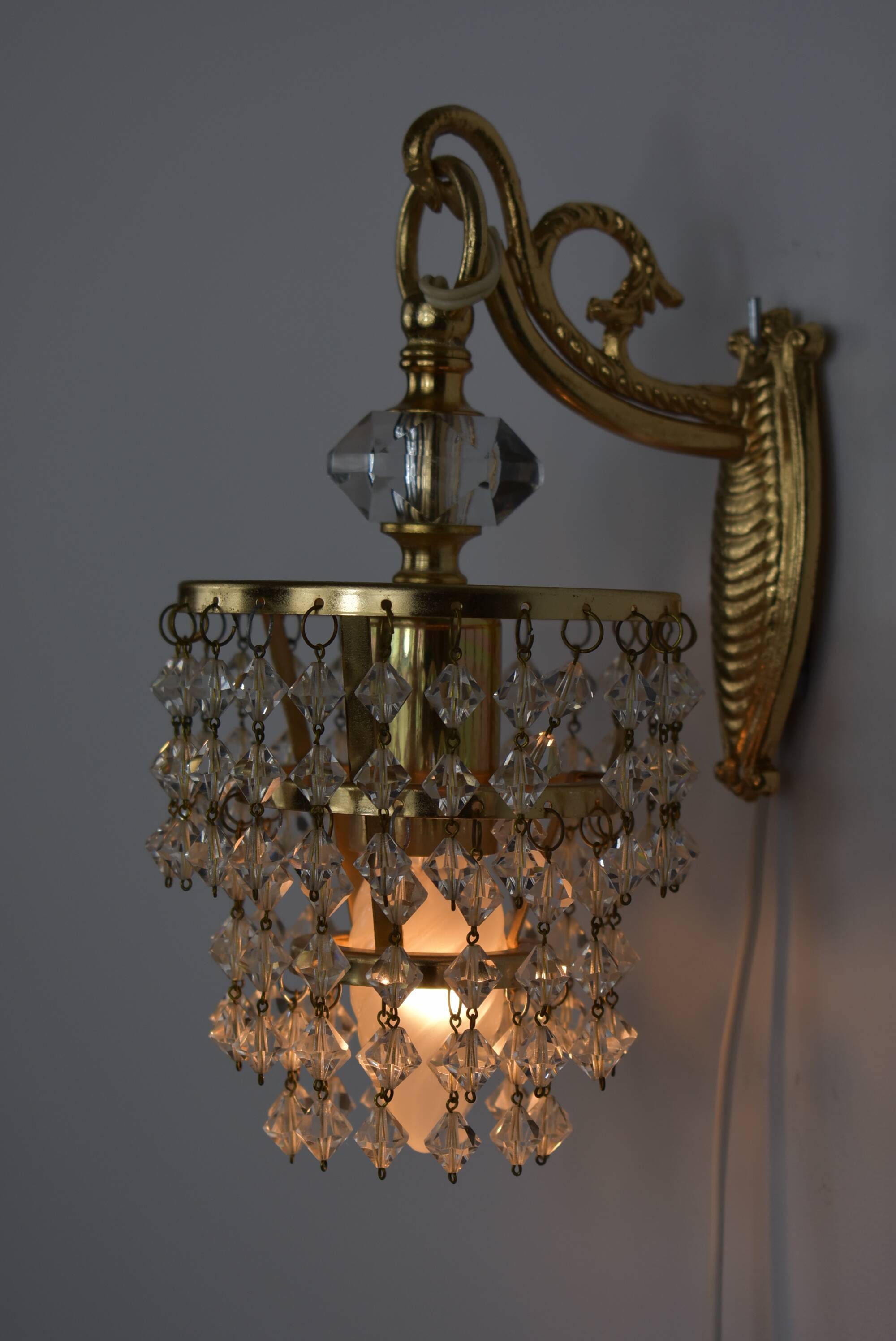 Pair of gold wall light with stamps