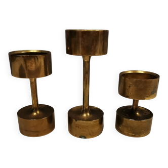 Three beautiful candle holders in solid brass, for block candles.