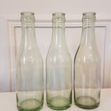 Suite of three old small glass bottles