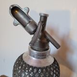 Old glass and metal siphon