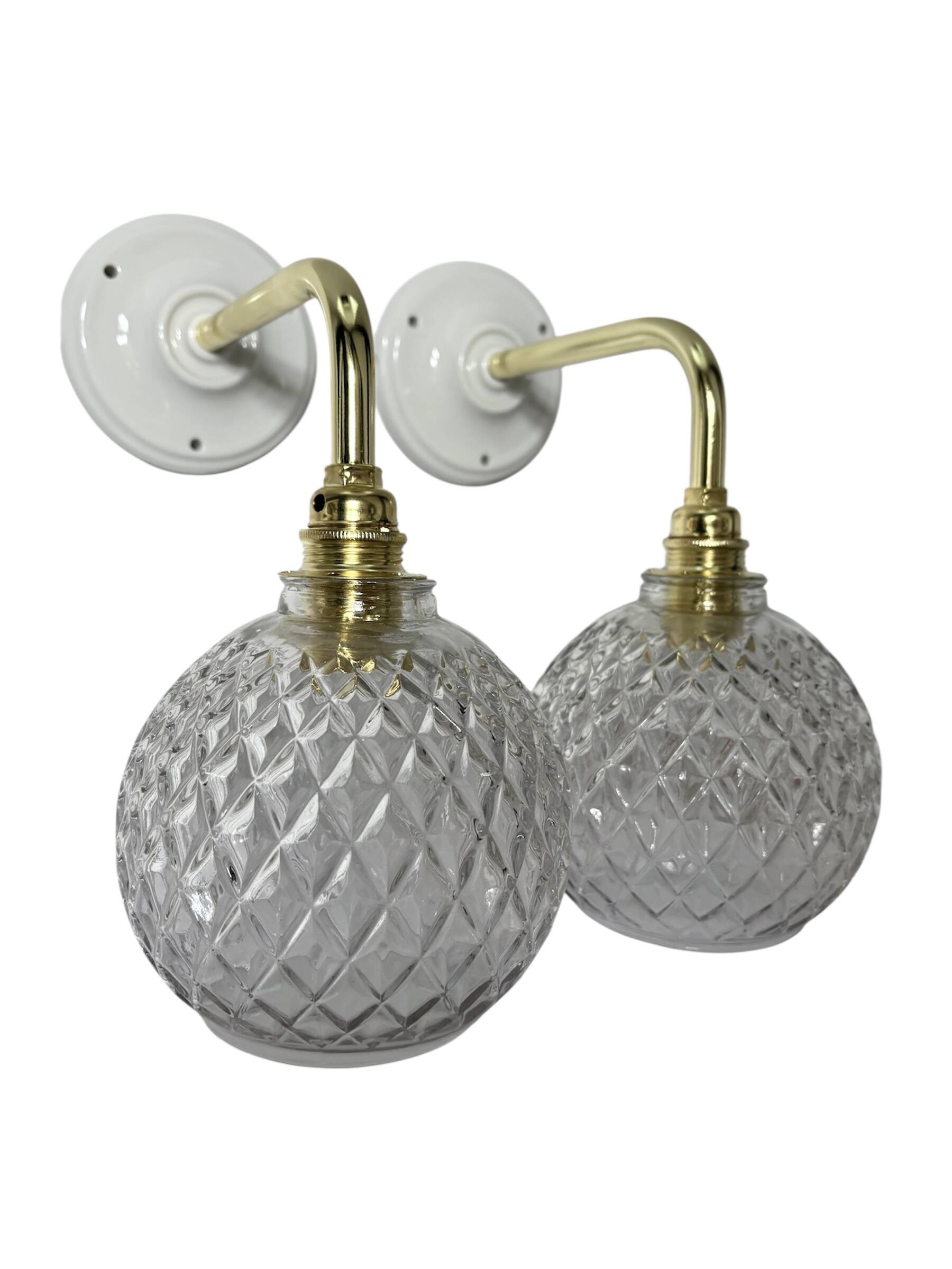 Pair of chiseled glass globe wall sconces