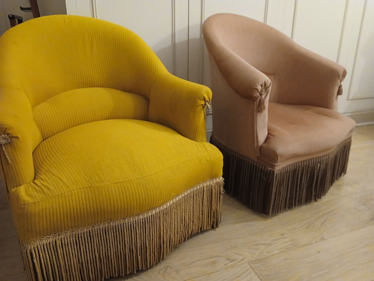 Set of 2 yellow and pink velvet tub chairs.