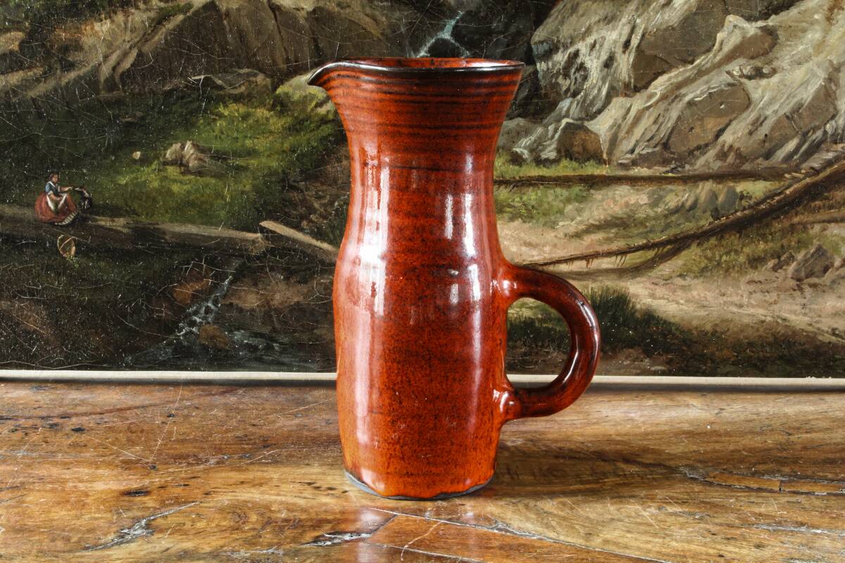 Signed orange ceramic candle holder and jug
