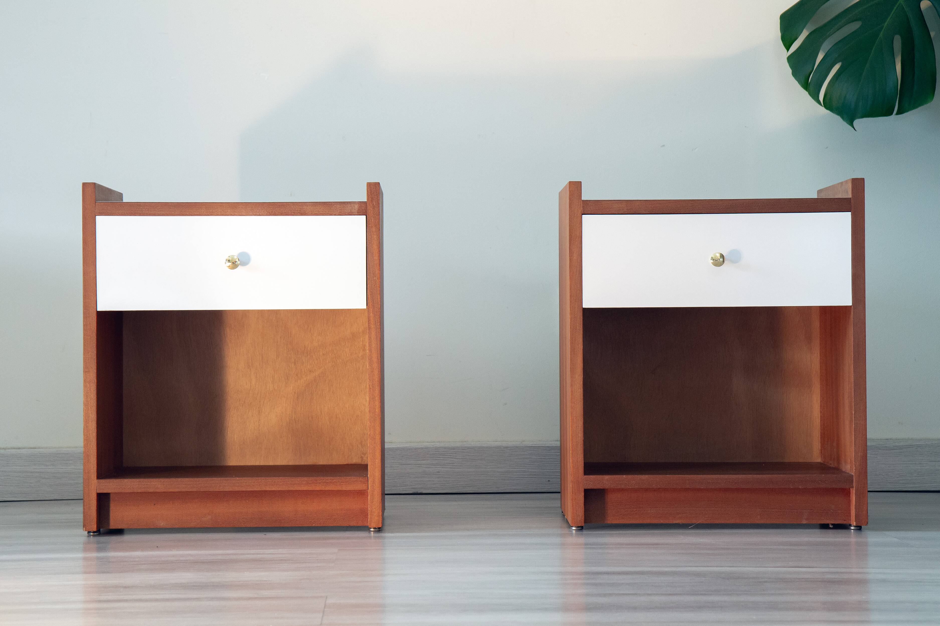 Pair of bedside tables, mahogany, white laminate and brass, 1970