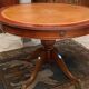 Circular table in light mahogany and leather base claw English style