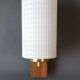 1960 wall light in gilded brass and rosewood.