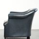 Dark blue cowhide club armchair with a unique and timeless design
