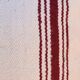 burgundy and white striped cushion in handmade wool