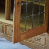 20th-century mid-century solid oak sideboard with glass front, by a Danish cabinetmaker.
