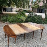 Half moon table forming walnut dining room table with 19th century period system