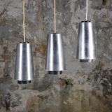 Trio of Raak steel pendant lights, 1960s