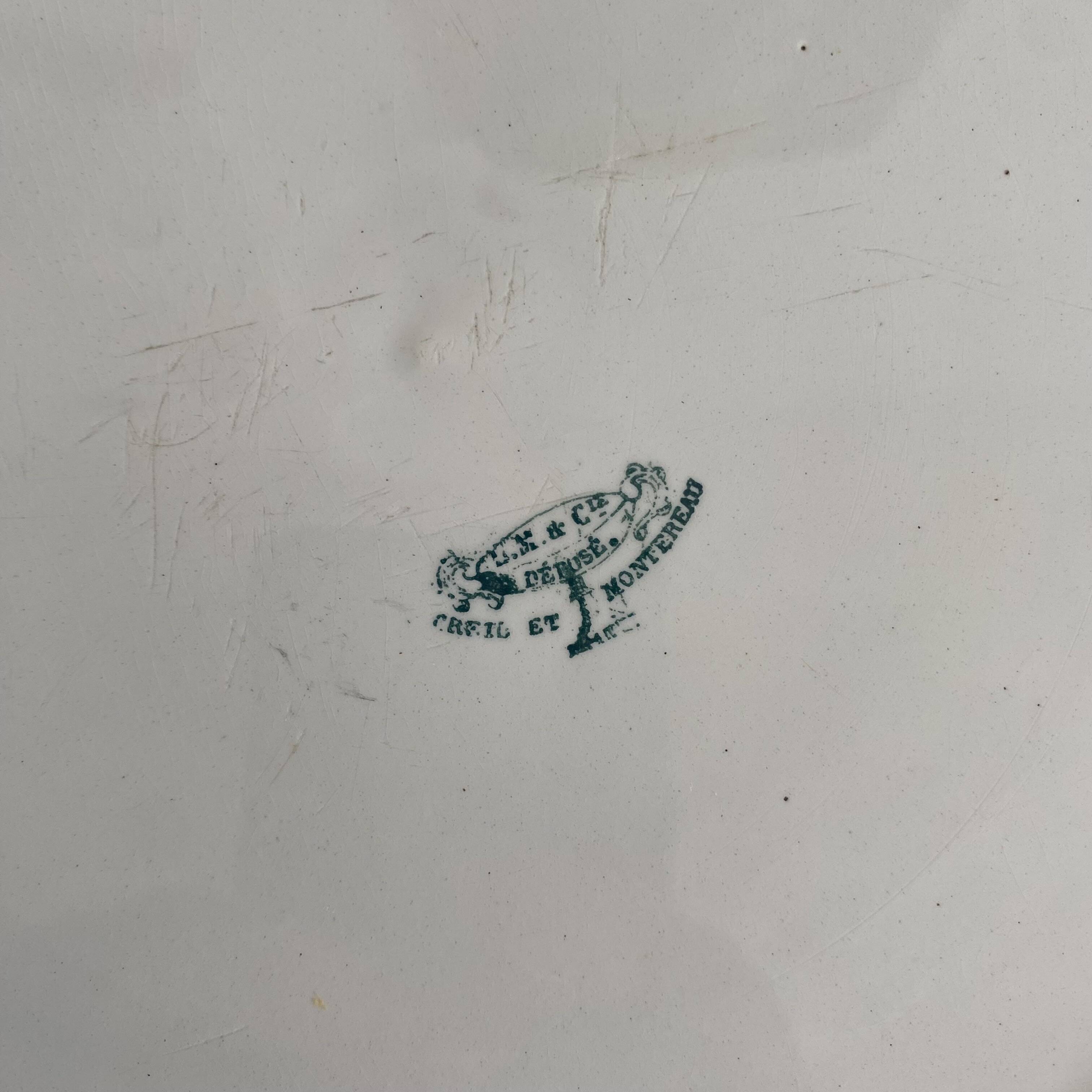 Set of large round white earthenware dishes from Creil and Montereau, 19th century