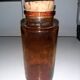 Amber pharmacy bottle made of old bubbled glass