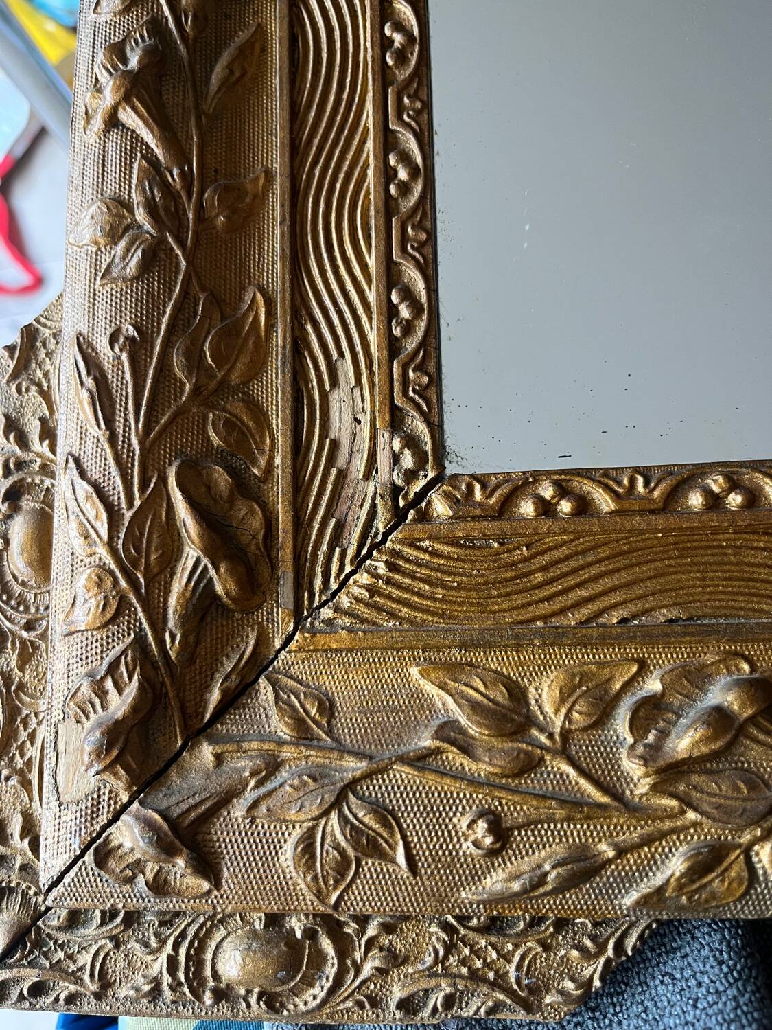 Golden trumeau mirror for fireplace, late 19th century, with sculpted pediment.