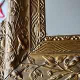 Golden trumeau mirror for fireplace, late 19th century, with sculpted pediment.