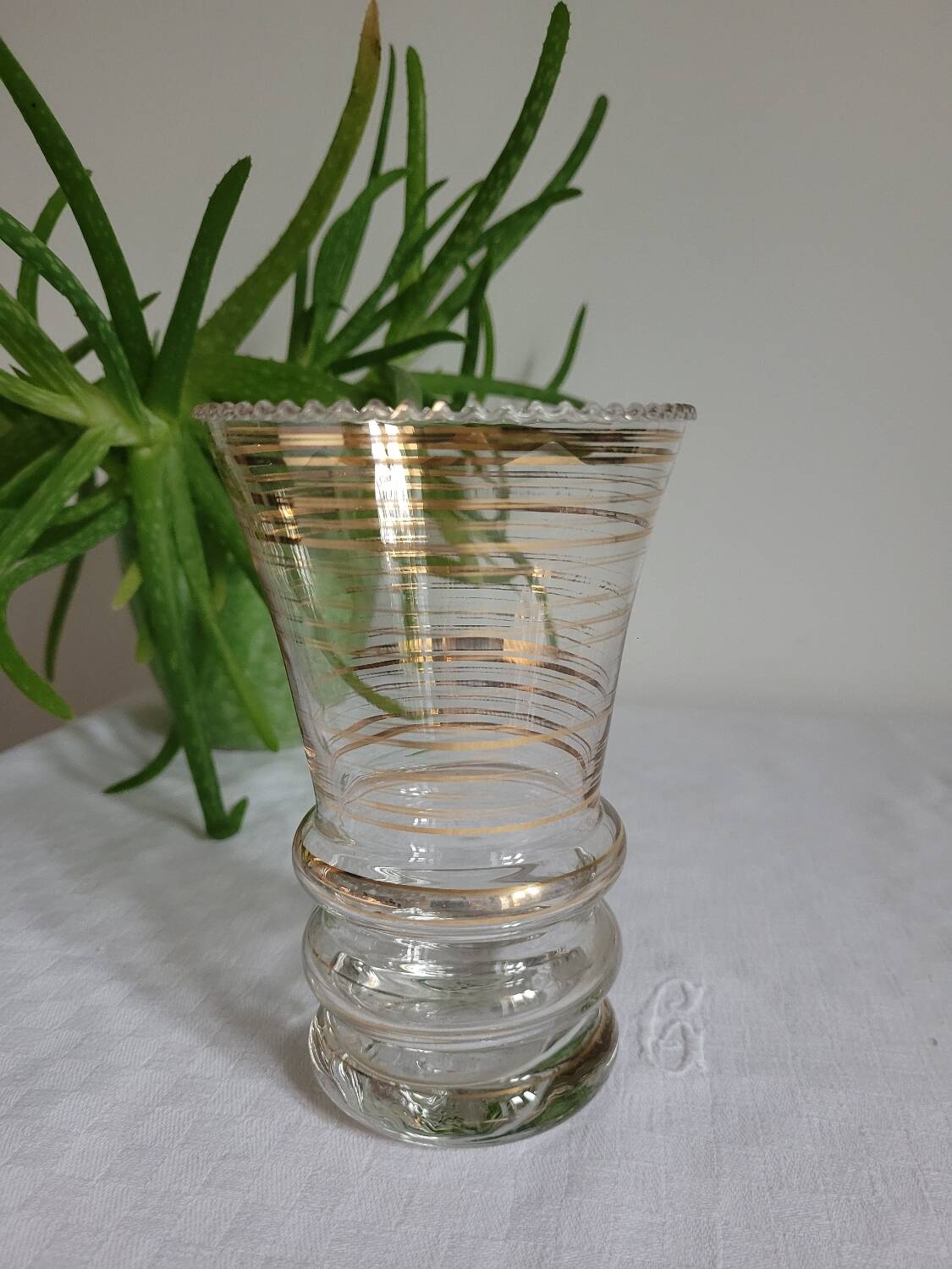 Flared glass vase with gold trim