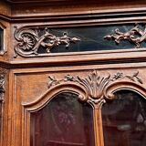 Antique rococo sideboard with integrated clock.