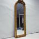 Large gold full-length mirror with ornate crest