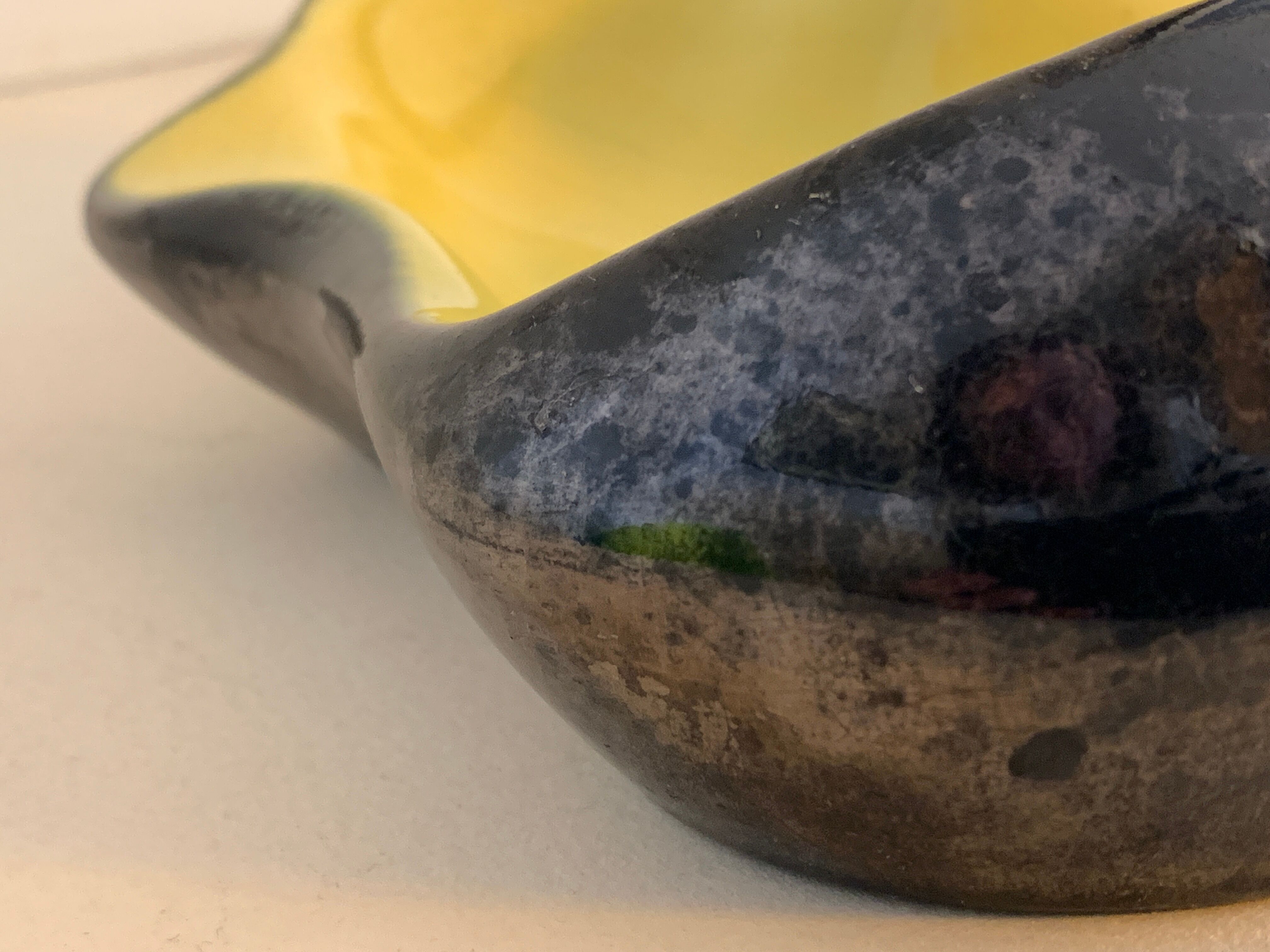 Yellow and black ceramic ashtray