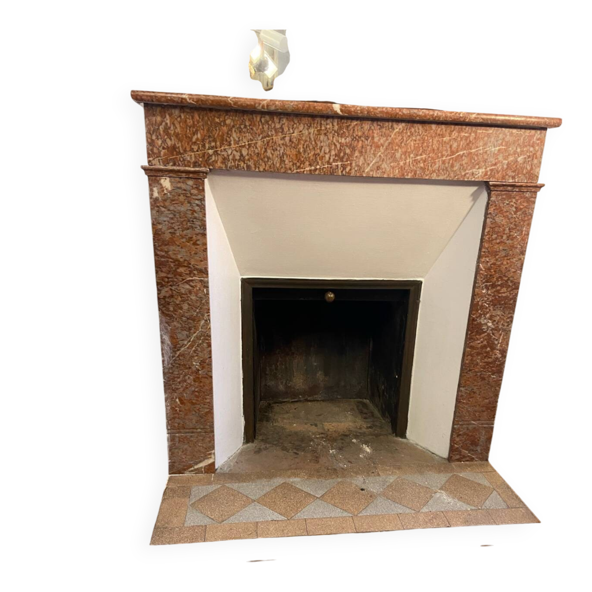 Marble fireplace surround with closed hearth frame.