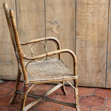 Asymmetrical rattan armchair