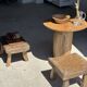 Small stool, square solid teak side table with a curved seat.