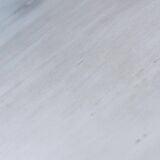 Round Art Deco black painted wooden side table with lower shelf, 1930s.