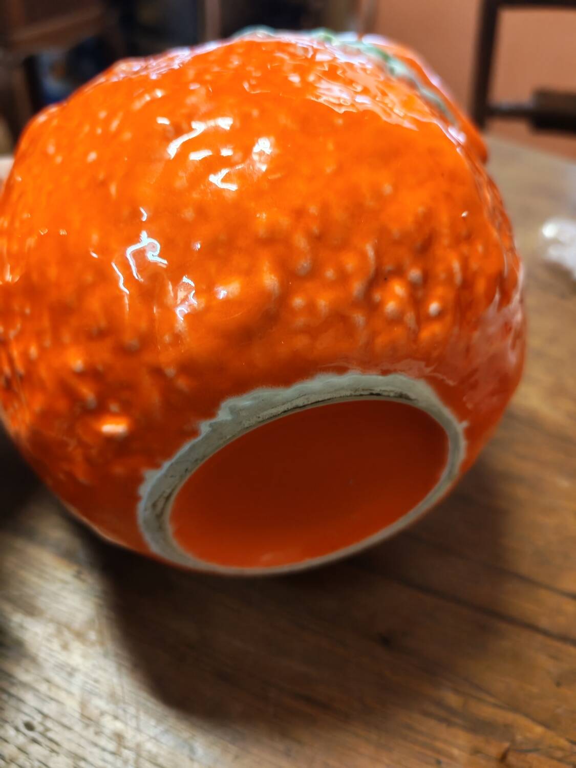 Orange slipware pitcher