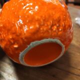 Orange slipware pitcher