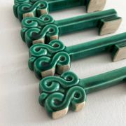 4 green ceramic knife rests in vintage key shape