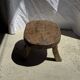 Small stool, oval solid teak side table with curved legs in wabi-sabi style.