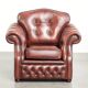 Cowhide chesterfield armchair in a warm brown colour with decorative nails