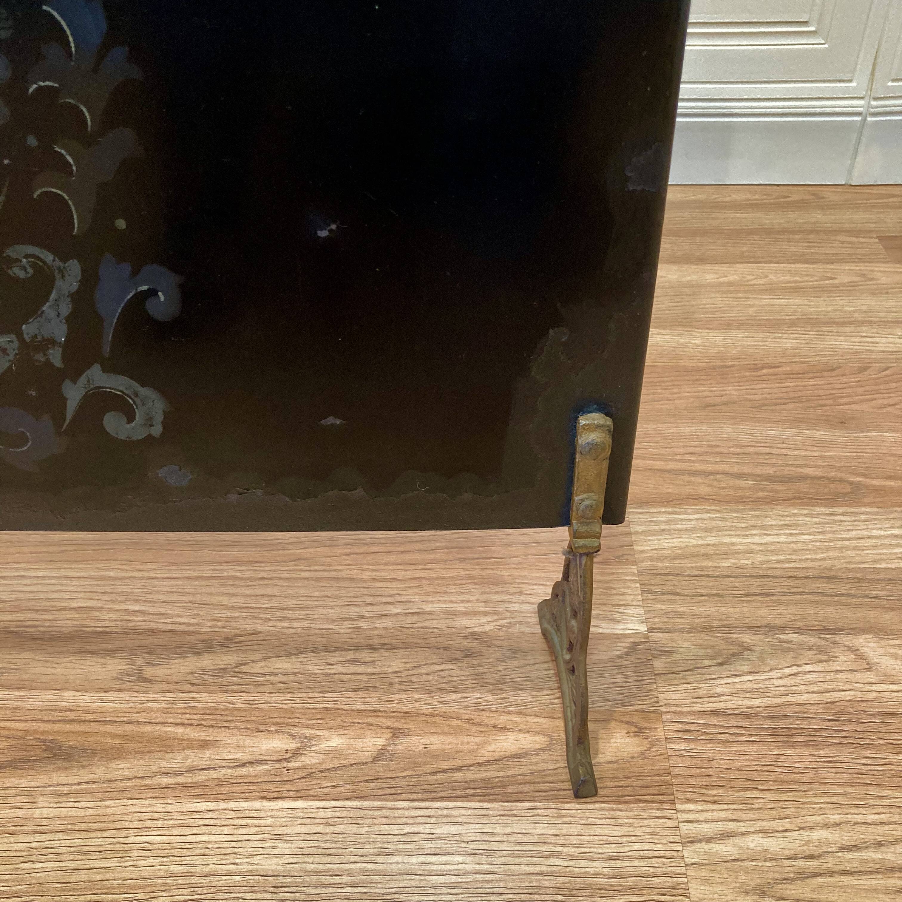 Metal fireplace screen from the period.