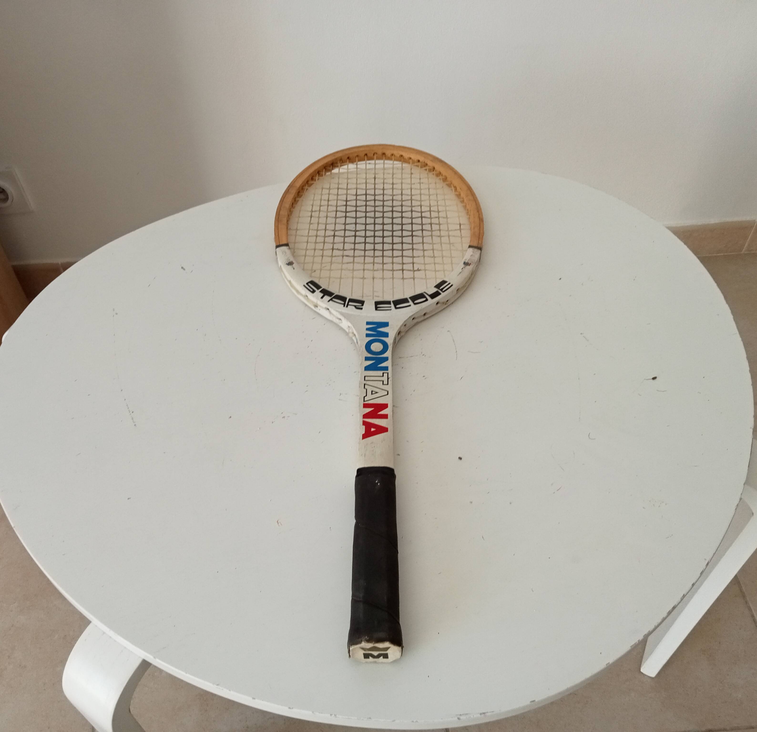 Vintage wooden tennis racket Montana