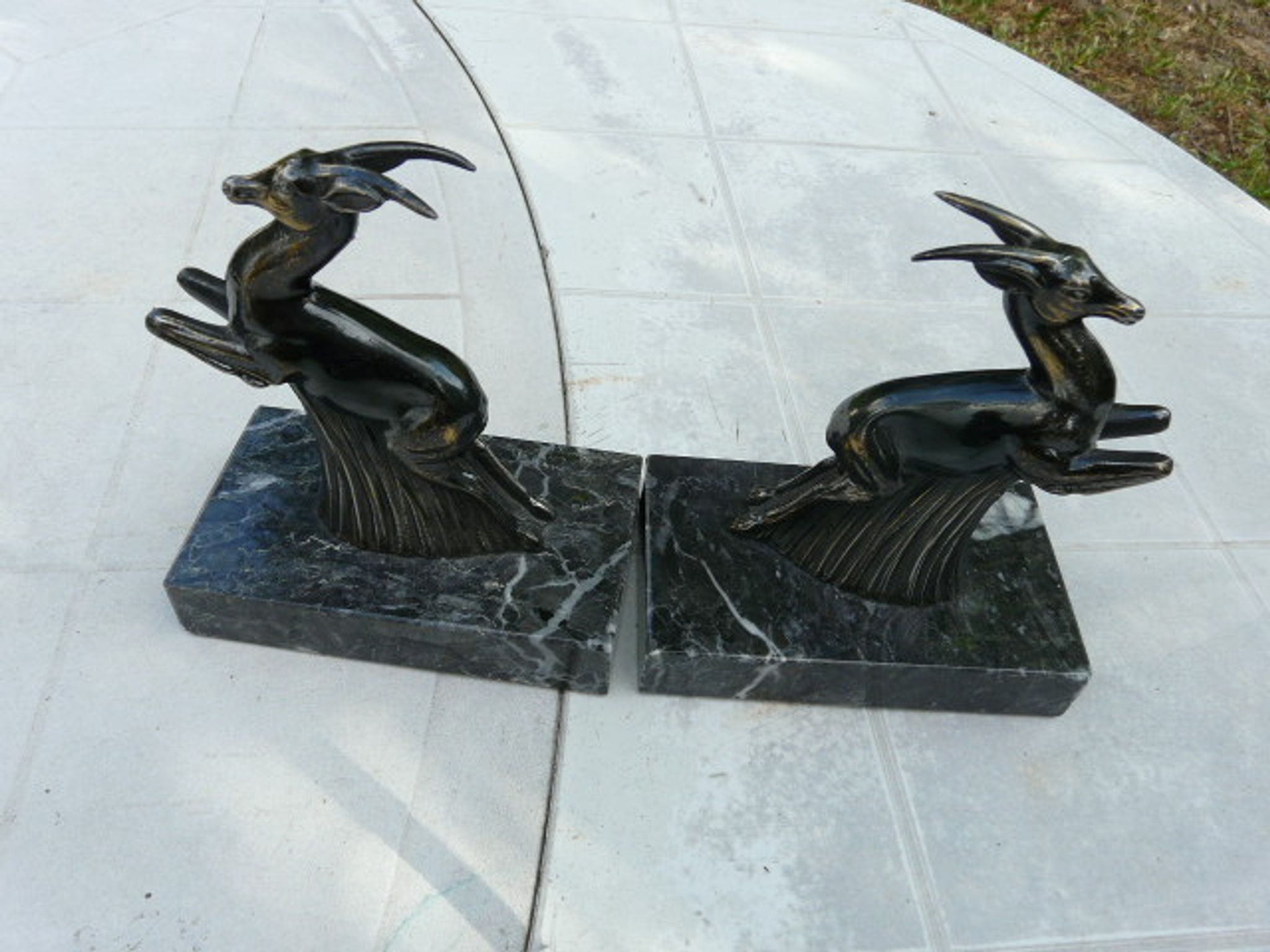 Pair of greenhouse book antelope in regulation on marble base