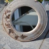 Round ceramic mirror signed