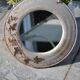 Round ceramic mirror signed