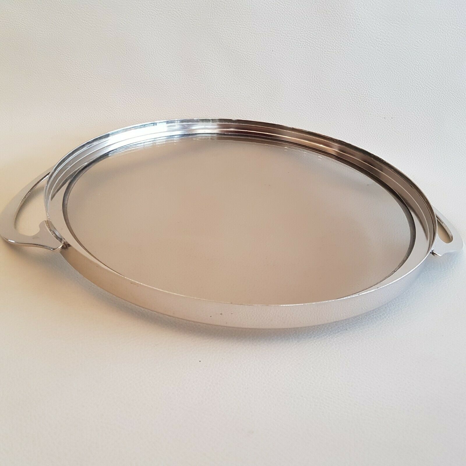 Round glass and art deco silver metal tray